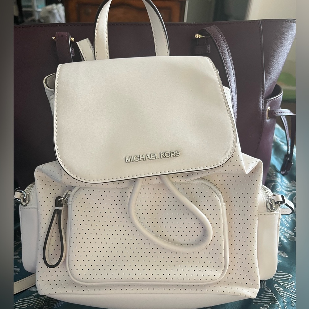 White Michael Khors backpack purse.  Used only a few times.